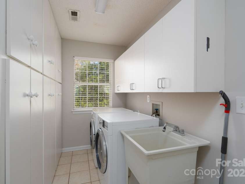 6111 Tesh Court, Charlotte, NC 28269.  MLS# CAR4239195, YatesRealty ID 6183. Laundry and Mud Room with tons of cabinet storage