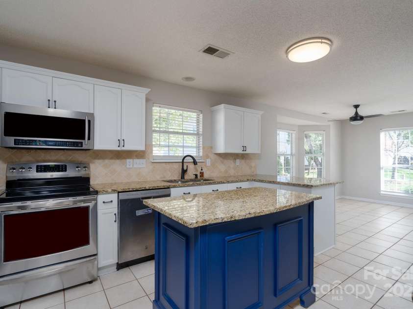 6111 Tesh Court, Charlotte, NC 28269.  MLS# CAR4239195, YatesRealty ID 6183. Stainless steel appliances and lots on countertop space.