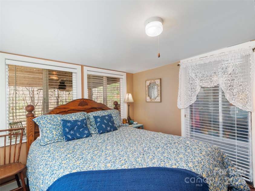 16 Limestone Drive, Franklin, NC 28734.  MLS# CAR4244542, YatesRealty ID 6187. A peaceful retreat that blends cottage style with mountain ease — simple, homey, and full of light.