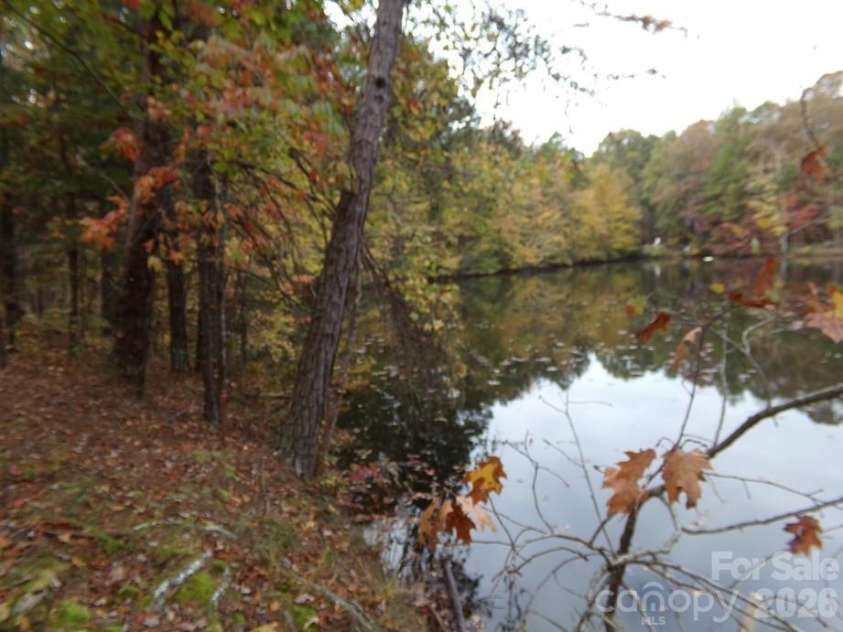 627 Bolick Road, Fort Mill, SC 29707.  MLS# CAR4403407, YatesRealty ID 6192. View to Pond Dam