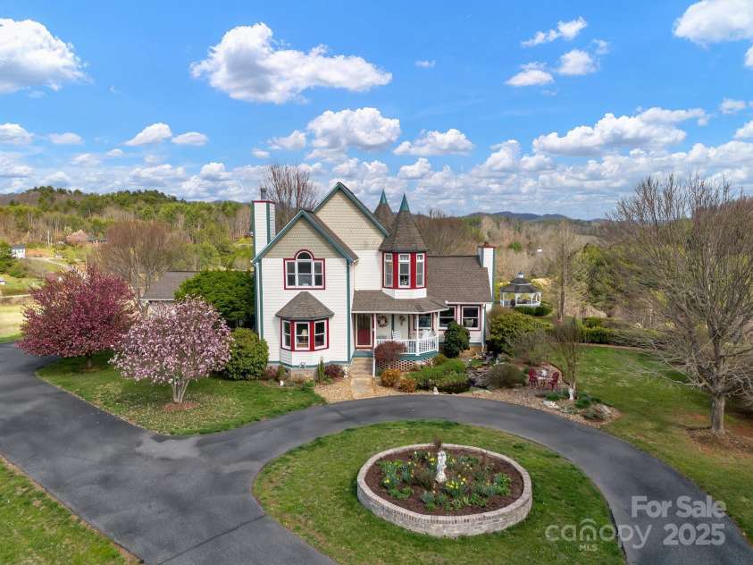 122 Windy Hills Lane, Leicester, NC 28748.  MLS# CAR4240865, YatesRealty ID 6195. Aerial view - front elevation of home
