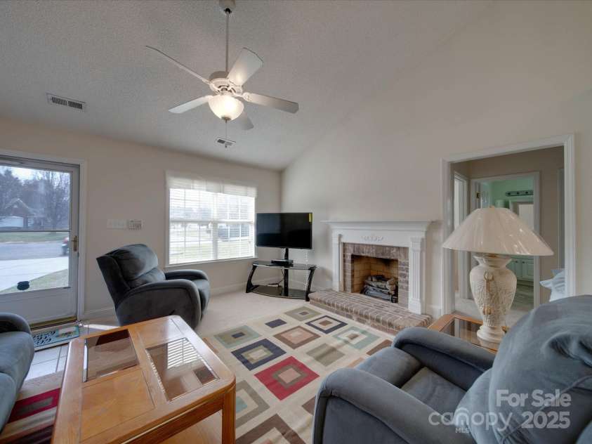 8353 Emily Drive, Harrisburg, NC 28075.  MLS# CAR4225347, YatesRealty ID 6198. Family room with Gas Log Fireplace