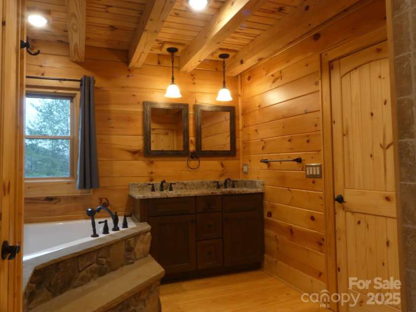 214 Whitney Boulevard, Lake Lure, NC 28746.  MLS# CAR4231828, YatesRealty ID 621. Primary Bath