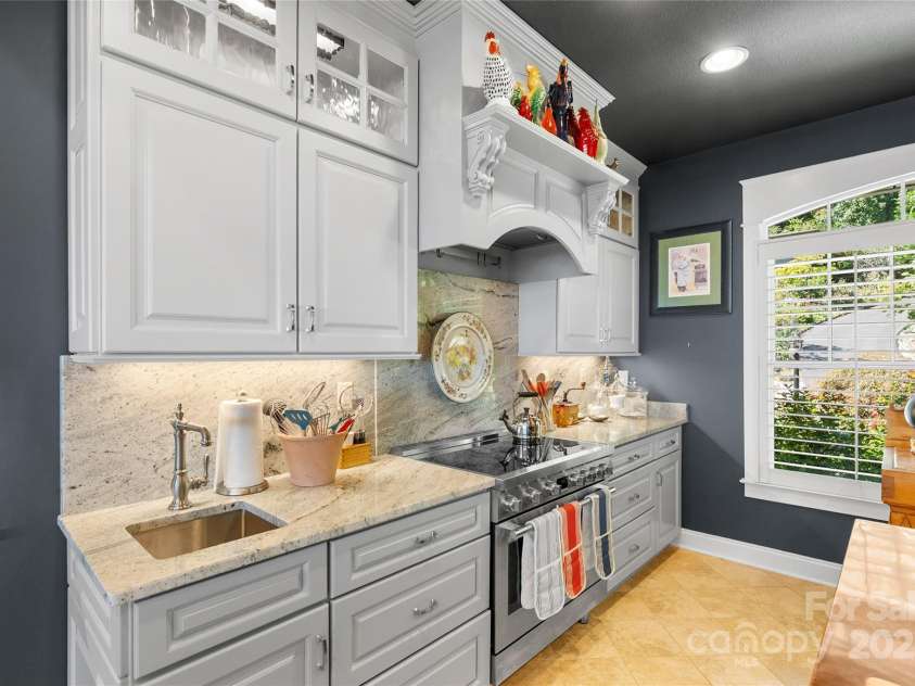 159 Alta Circle, Hendersonville, NC 28739.  MLS# CAR4300821, YatesRealty ID 6211. Induction cooktop and lighted cabinetry