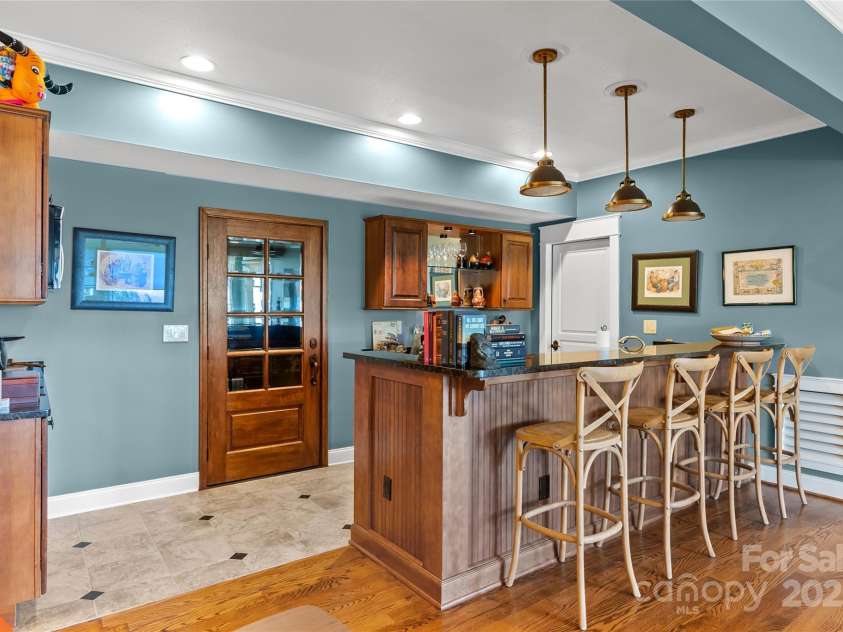 159 Alta Circle, Hendersonville, NC 28739.  MLS# CAR4300821, YatesRealty ID 6211. Kitchenette downstairs with wine storage