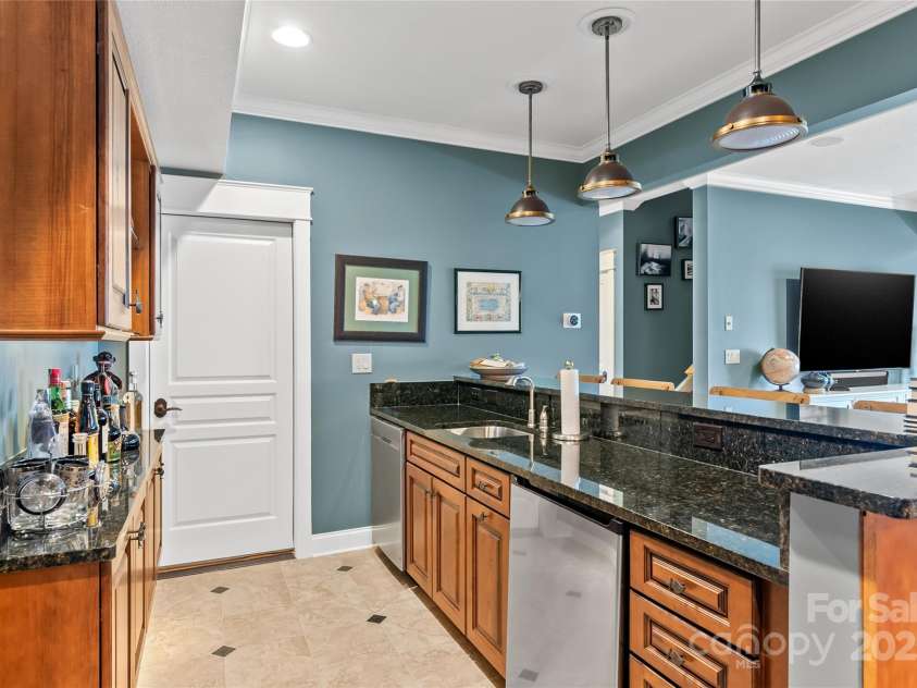 159 Alta Circle, Hendersonville, NC 28739.  MLS# CAR4300821, YatesRealty ID 6211. Kitchenette with dishwasher and refrigerator