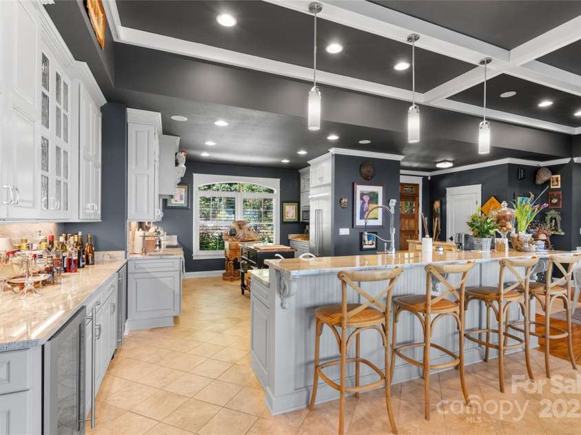 159 Alta Circle, Hendersonville, NC 28739.  MLS# CAR4300821, YatesRealty ID 6211. Sophisticated and graciously appointed kitchen flows seamlessly into the living area.