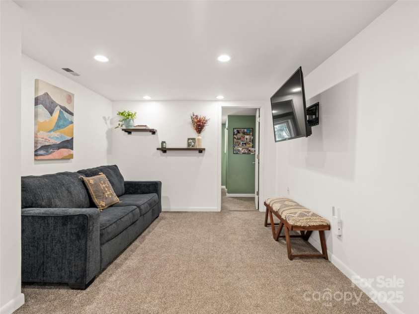 93 Morningside Drive, Asheville, NC 28806.  MLS# CAR4244401, YatesRealty ID 6214. Small office off of basement den