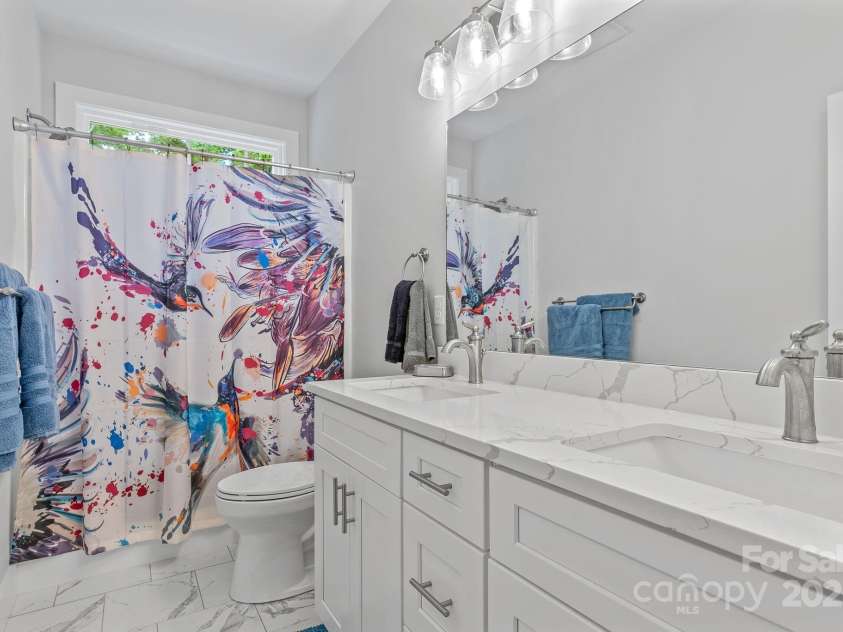 182 Country Drive, Mars Hill, NC 28754.  MLS# CAR4161699, YatesRealty ID 6228. Lower bathroom