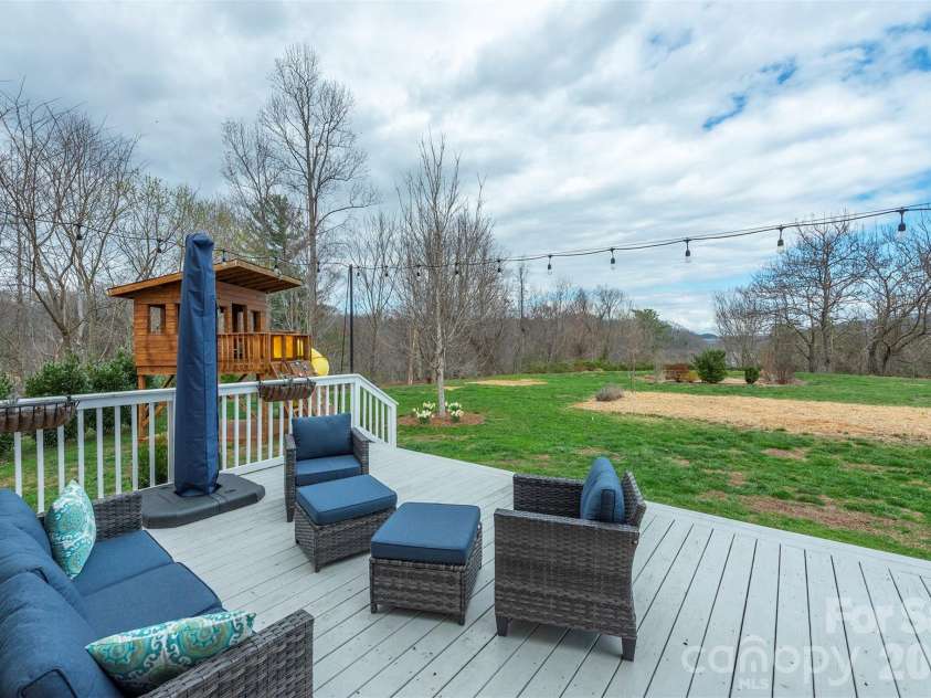 53 Stone River Drive, Asheville, NC 28804.  MLS# CAR4342463, YatesRealty ID 6239. Deck Looking out over backyard and HOA Area