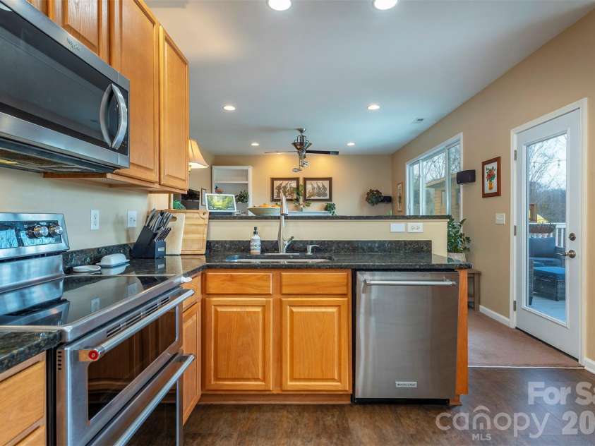 53 Stone River Drive, Asheville, NC 28804.  MLS# CAR4342463, YatesRealty ID 6239. Kitchen > Great Room