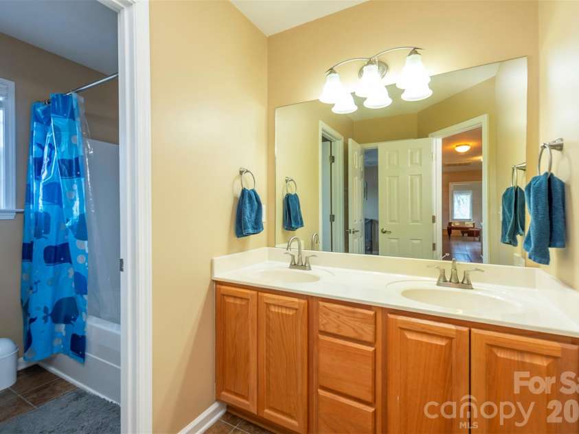 53 Stone River Drive, Asheville, NC 28804.  MLS# CAR4342463, YatesRealty ID 6239. Shared Upstairs Bath with Double Vanity