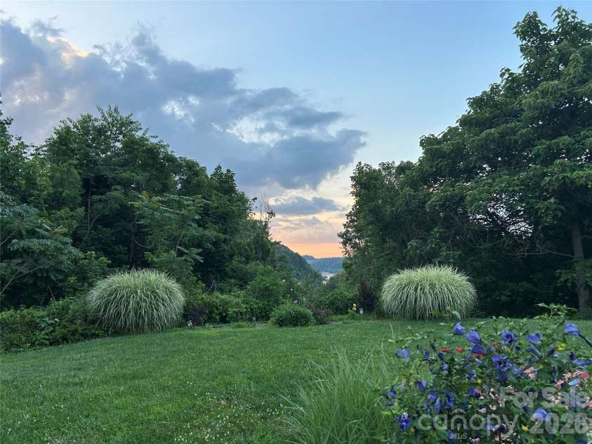 53 Stone River Drive, Asheville, NC 28804.  MLS# CAR4342463, YatesRealty ID 6239. Summer Views at 53 Stone River