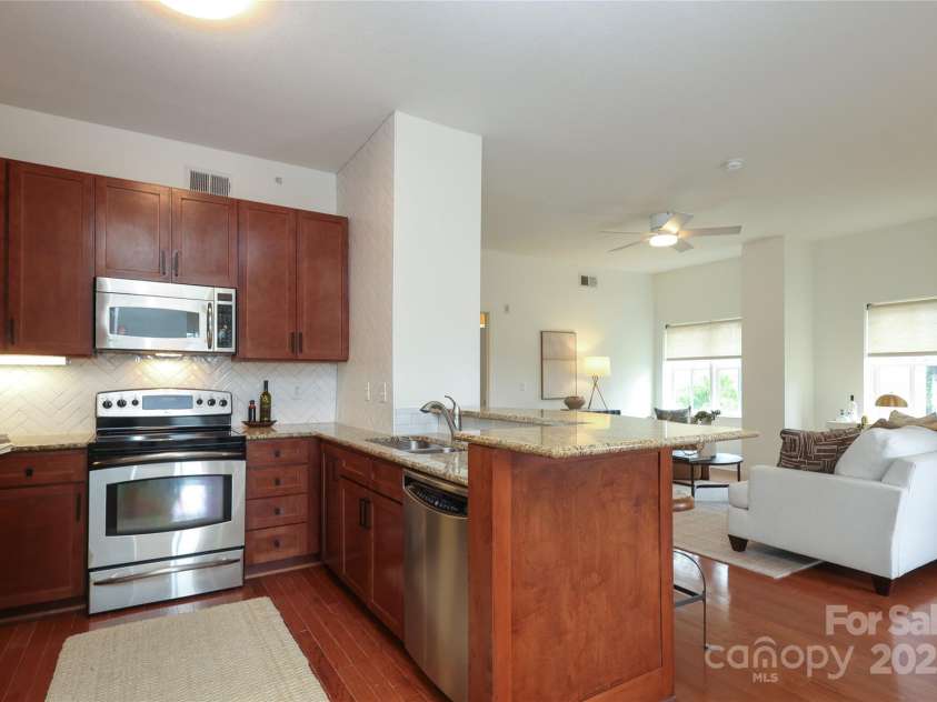 721 Governor Morrison Street, Charlotte, NC 28211.  MLS# CAR4253378, YatesRealty ID 624. Kitchen has new herringbone tile and granite counters