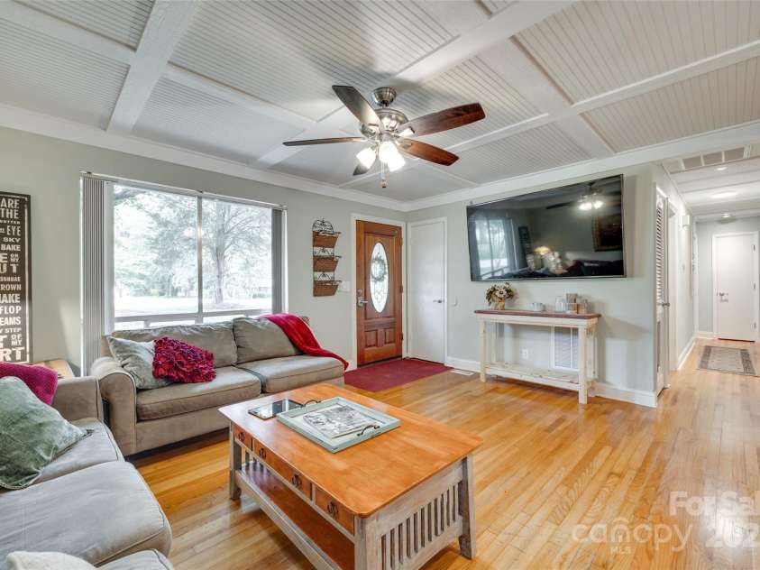 504 Amon Lane, Pineville, NC 28134.  MLS# CAR4263309, YatesRealty ID 6243. Large windows let the natural light flood in to the Living Room