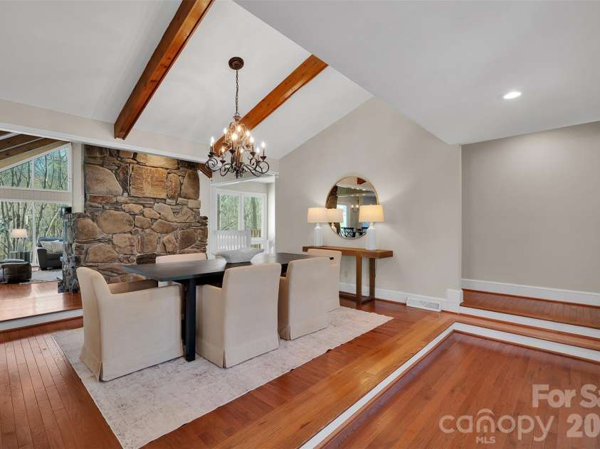 10311 Stonemede Lane, Matthews, NC 28105.  MLS# CAR4359875, YatesRealty ID 6244. Dining area with vaulted ceiling and beams