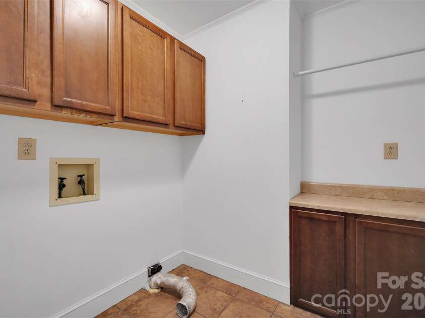 10311 Stonemede Lane, Matthews, NC 28105.  MLS# CAR4359875, YatesRealty ID 6244. Laundry room