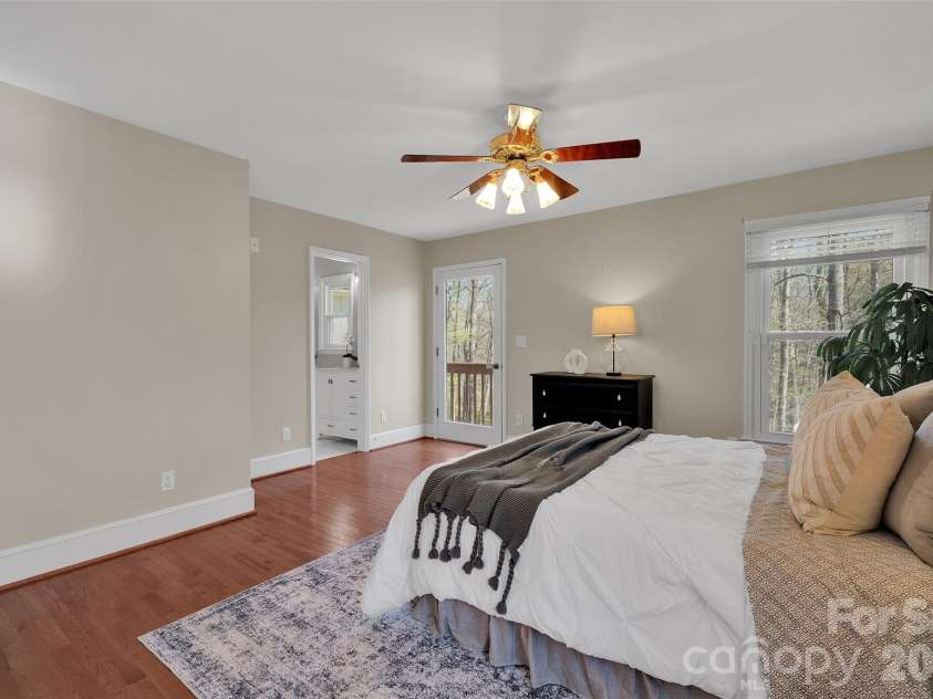 10311 Stonemede Lane, Matthews, NC 28105.  MLS# CAR4359875, YatesRealty ID 6244. Primary suite with balcony overlooking backyard