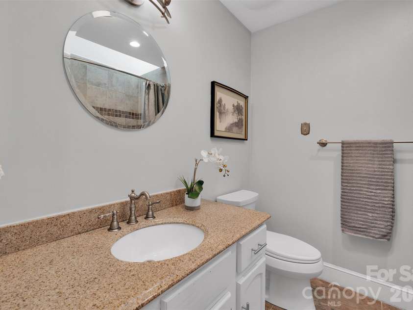 10311 Stonemede Lane, Matthews, NC 28105.  MLS# CAR4359875, YatesRealty ID 6244. Secondary bath has skylight
