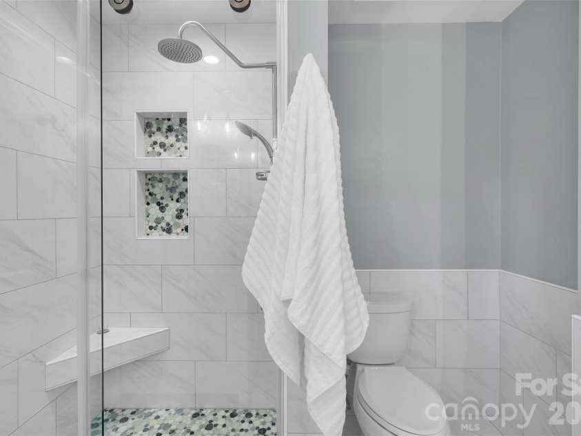 10311 Stonemede Lane, Matthews, NC 28105.  MLS# CAR4359875, YatesRealty ID 6244. Updated primary shower