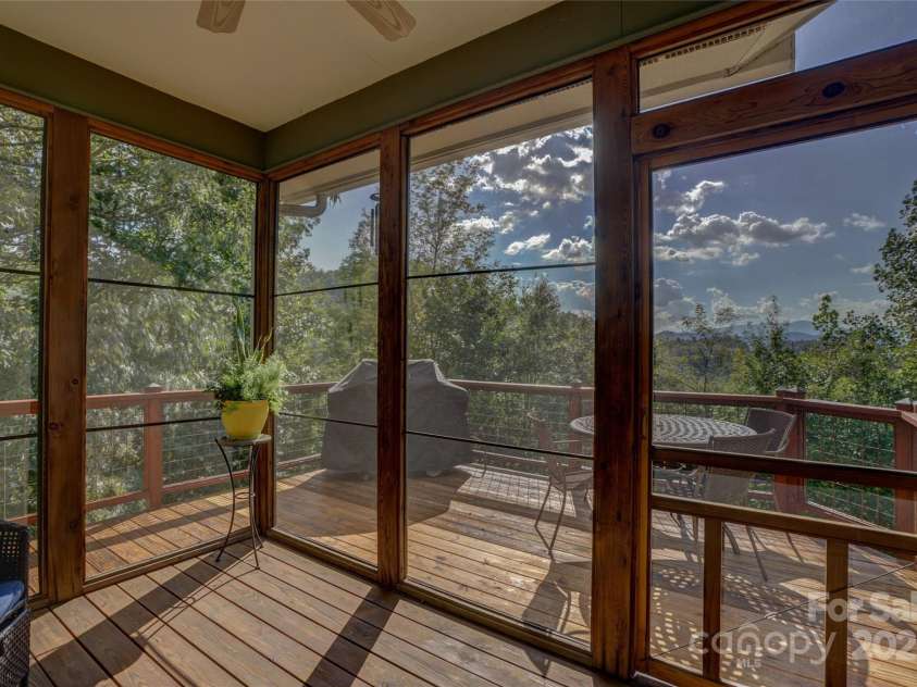 425 Sawmill Creek Road, Bryson City, NC 28713.  MLS# CAR4234274, YatesRealty ID 6247. Back Screened Porch to Deck