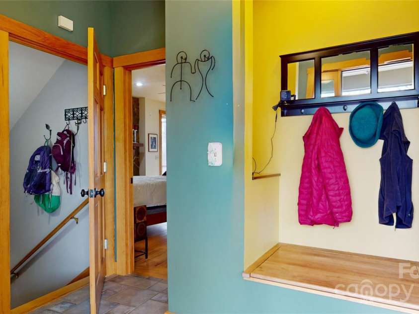 425 Sawmill Creek Road, Bryson City, NC 28713.  MLS# CAR4234274, YatesRealty ID 6247. Entrance w/ Bench and Coat Rack