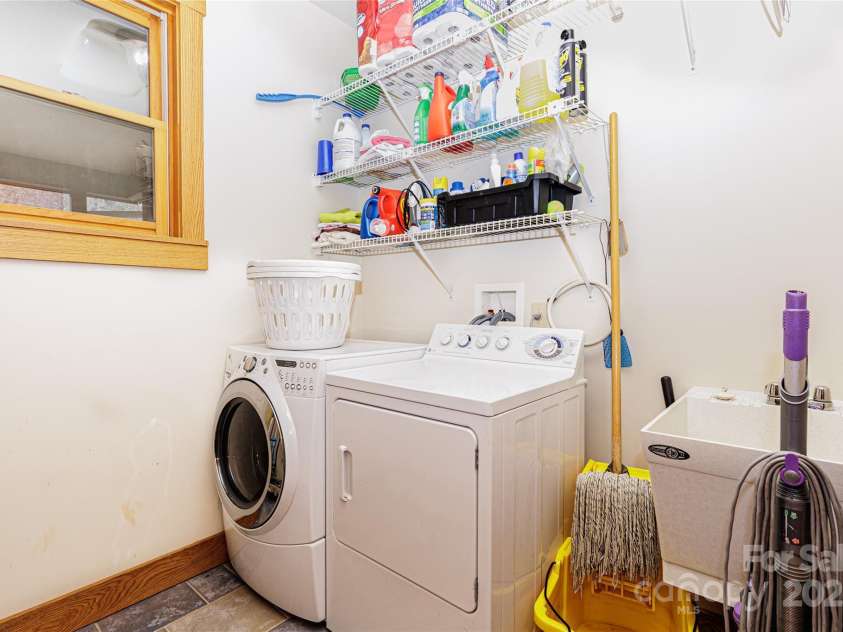 425 Sawmill Creek Road, Bryson City, NC 28713.  MLS# CAR4234274, YatesRealty ID 6247. Laundry off Front Hall