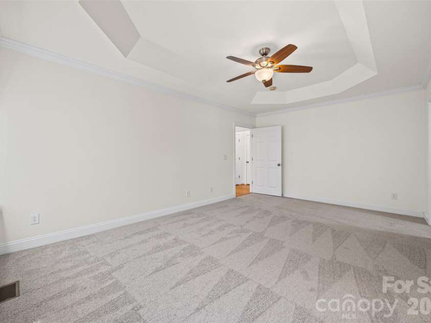 4042 Sunset Ridge Drive, Rock Hill, SC 29732.  MLS# CAR4347059, YatesRealty ID 6249. Tray ceiling in primary bedroom