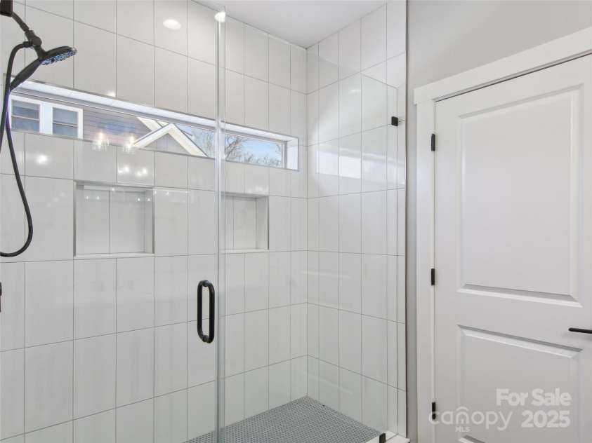 72 Jonestown Road, Woodfin, NC 28804.  MLS# CAR4229228, YatesRealty ID 6249. Walk in shower primary bathroom