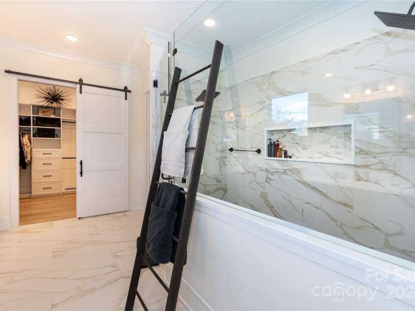 124 Direct Drive, Mooresville, NC 28117.  MLS# CAR4202552, YatesRealty ID 625. Huge shower with dual shower heads.