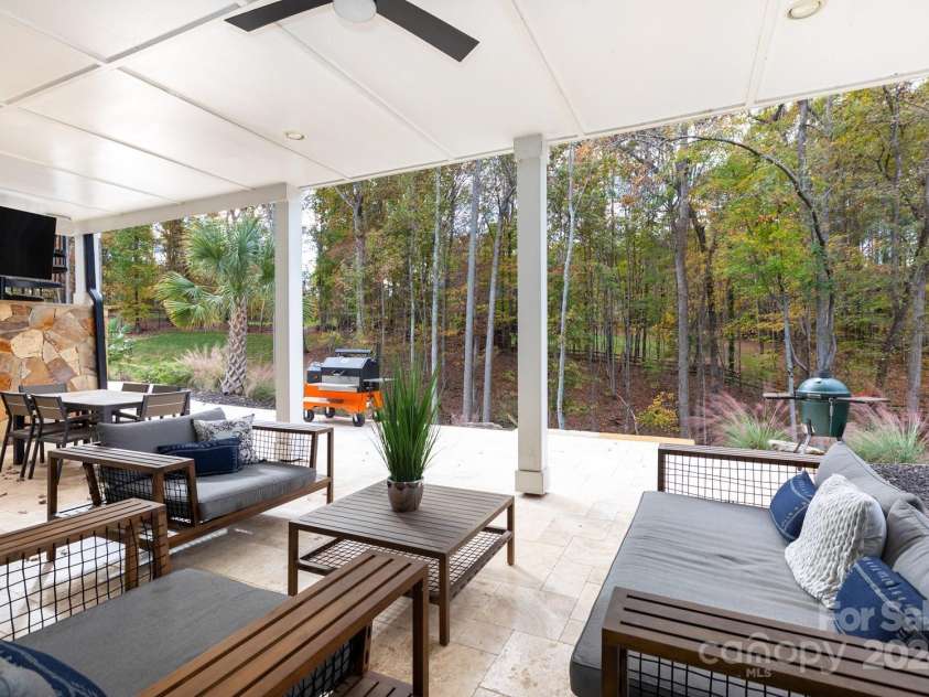 124 Direct Drive, Mooresville, NC 28117.  MLS# CAR4202552, YatesRealty ID 625. Lovely covered travertine patio.