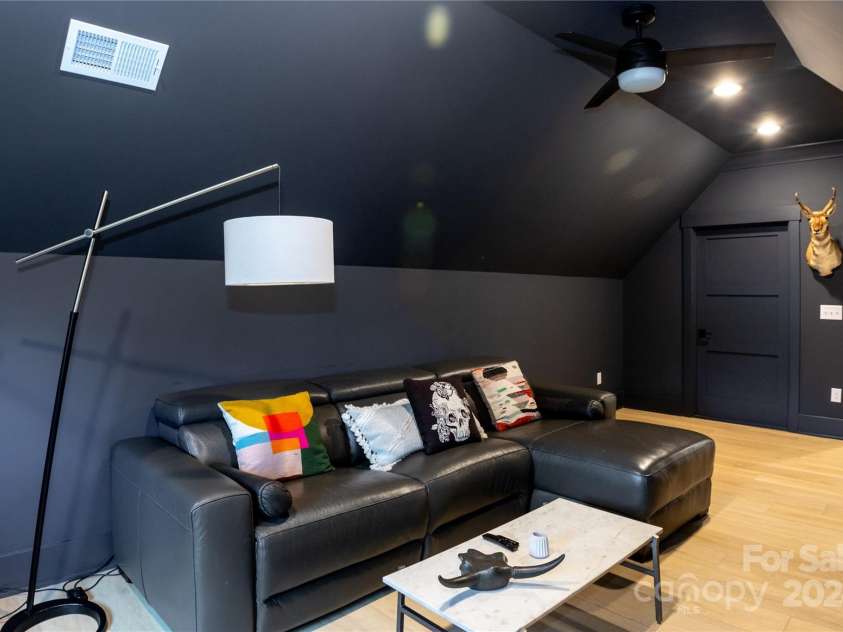 124 Direct Drive, Mooresville, NC 28117.  MLS# CAR4202552, YatesRealty ID 625. Suite bonus room. Beyond that door is a large floored attic space for storage.