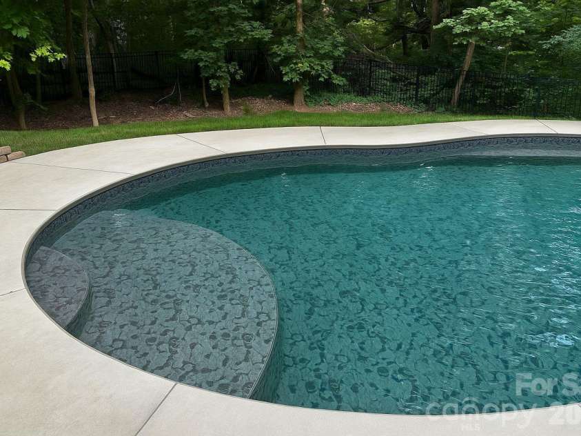 1431 Piper Court, Concord, NC 28025.  MLS# CAR4349971, YatesRealty ID 6250. Heated Pool with Tanning Ledge