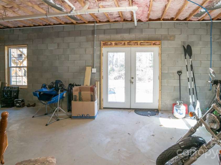 2257 Messer Road, Valdese, NC 28690.  MLS# CAR4209555, YatesRealty ID 6252. French doors in basement leading to concrete patio