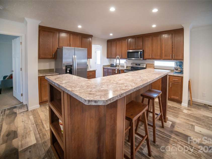 2257 Messer Road, Valdese, NC 28690.  MLS# CAR4209555, YatesRealty ID 6252. Kitchen island with bar seating