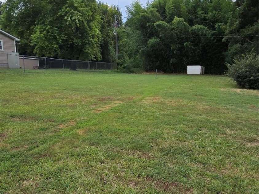 1629 and 1631 Harris Road, Fort Mill, SC 29708.  MLS# CAR4276684, YatesRealty ID 626. 1629 Harris Side Yard