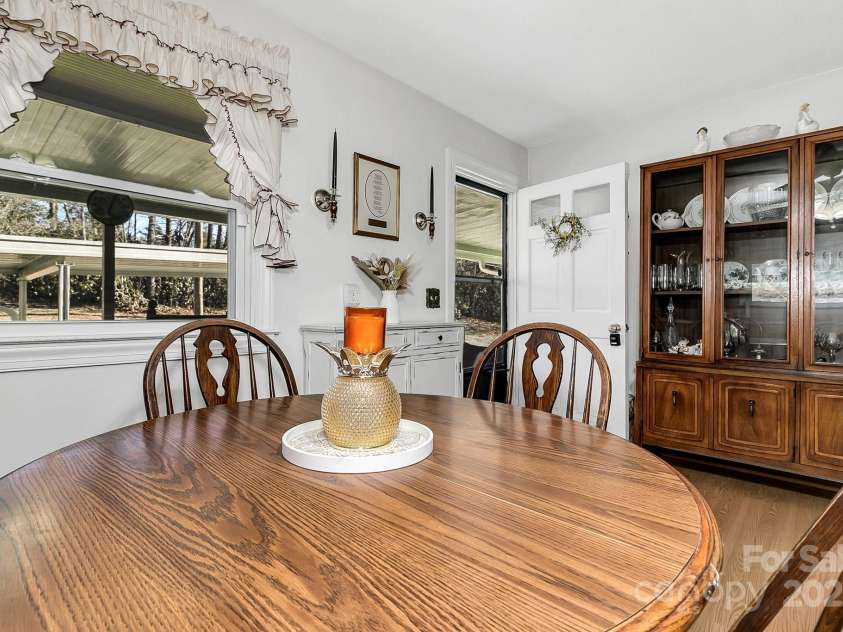 44 Tuttle Road, Hendersonville, NC 28792.  MLS# CAR4260886, YatesRealty ID 6261. Kitchen Door leads to covered back porch.