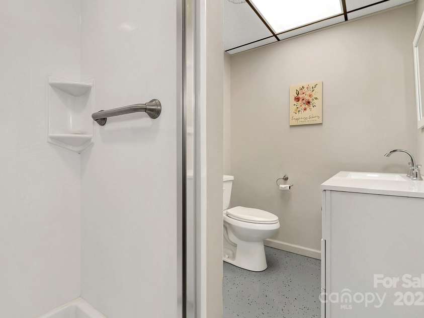 44 Tuttle Road, Hendersonville, NC 28792.  MLS# CAR4318659, YatesRealty ID 6261. Downstairs full bath.