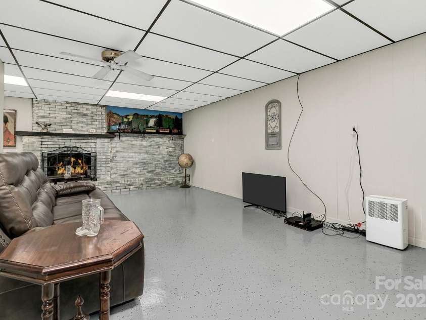 44 Tuttle Road, Hendersonville, NC 28792.  MLS# CAR4318659, YatesRealty ID 6261. Lower Level Living Room.