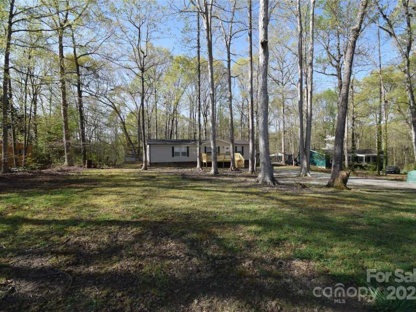 121 Silver Fox Court, Mount Holly, NC 28120.  MLS# CAR4241766, YatesRealty ID 6269. Home positioned toward middle of lot for privacy