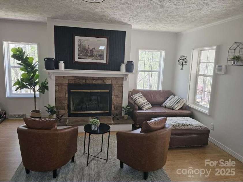 1597 Cleghorn Mill Road, Rutherfordton, NC 28139.  MLS# CAR4213254, YatesRealty ID 627. Cozy gas fireplace. LVP throughout the home. 