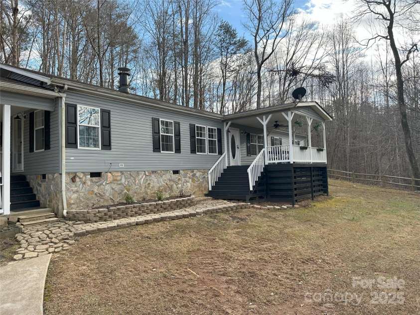 1597 Cleghorn Mill Road, Rutherfordton, NC 28139.  MLS# CAR4213254, YatesRealty ID 627. Situated on 6+ acres this home offers New Vinyl, Roof and lovely rock accents. 3 bedrooms/2.5 bathrooms. 