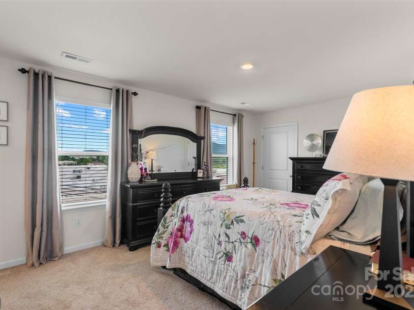 64 Benedict Lane, Weaverville, NC 28787.  MLS# CAR4208936, YatesRealty ID 627. Enjoy year round views from primary bedroom