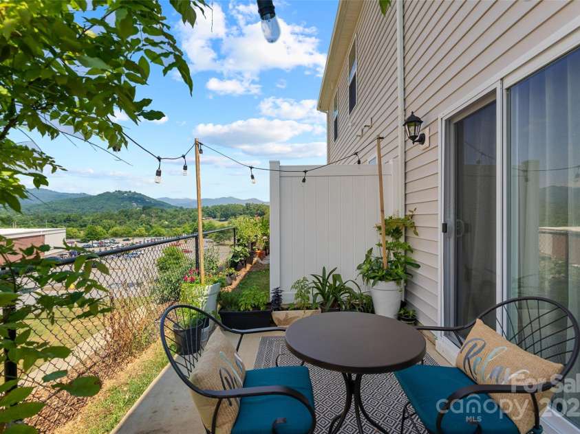 64 Benedict Lane, Weaverville, NC 28787.  MLS# CAR4208936, YatesRealty ID 627. Open rear patio area with privacy wall to enjoy the year round views