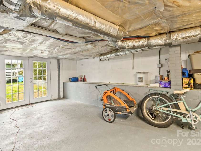 1301 Jackson Street, Kannapolis, NC 28083.  MLS# CAR4239935, YatesRealty ID 6273. Basement has doors to outside - perfect for storage or additional space to do what you want