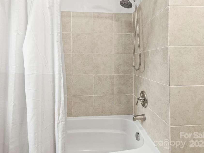 1301 Jackson Street, Kannapolis, NC 28083.  MLS# CAR4239935, YatesRealty ID 6273. Secondary bathroom with tile