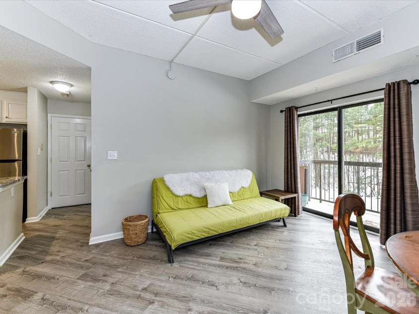 211 Heritage Boulevard, Fort Mill, SC 29715.  MLS# CAR4342832, YatesRealty ID 6275. Living Room + dining space currently with slider to balcony