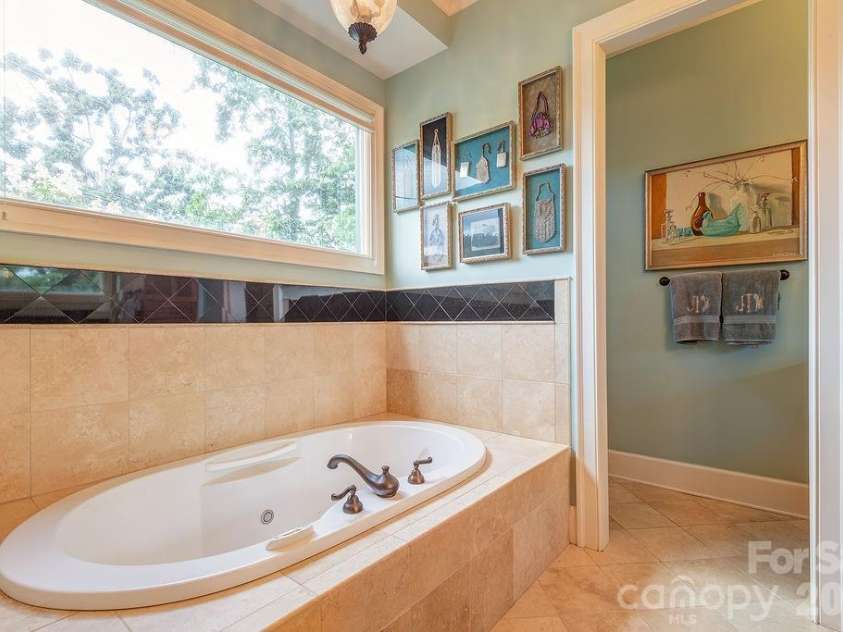 3 Gale Kelly Court, Weaverville, NC 28787.  MLS# CAR4361031, YatesRealty ID 6275. Primary bath with soaking tub and steam shower