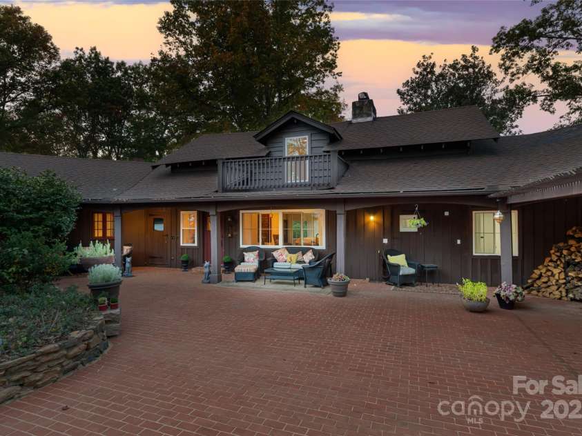 777 River Road, Tryon, NC 28782.  MLS# CAR4194239, YatesRealty ID 6286. The Hayloft in the twilight