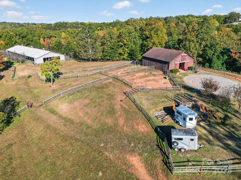 777 River Road, Tryon, NC 28782.  MLS# CAR4316725, YatesRealty ID 6286. Aerial - Pasture